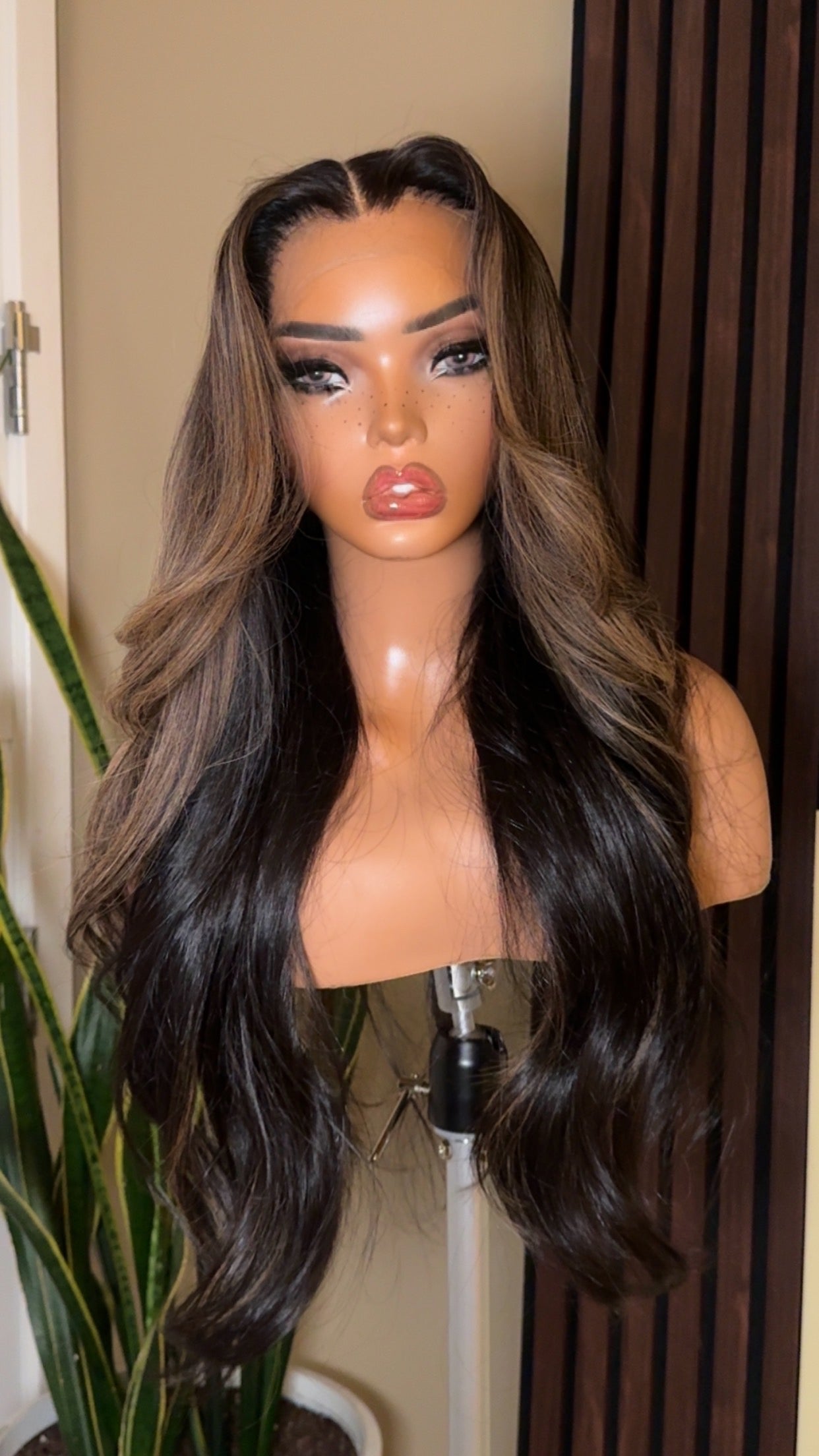 Mannequin displaying the Coco Kendyll “Zuri” custom honey espresso balayage wig — long, wavy unit with natural highlights and a flawless finish.